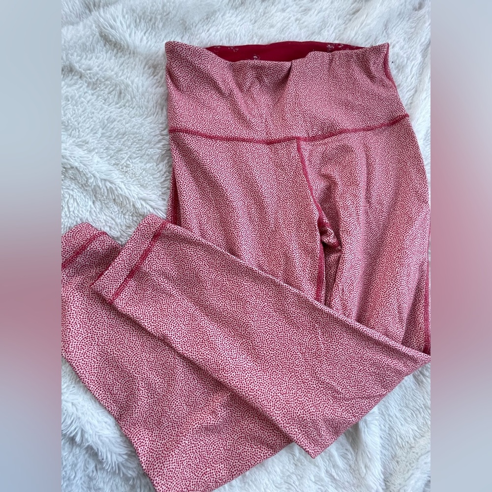 Reversible, red leggings, unknown size fits a small.